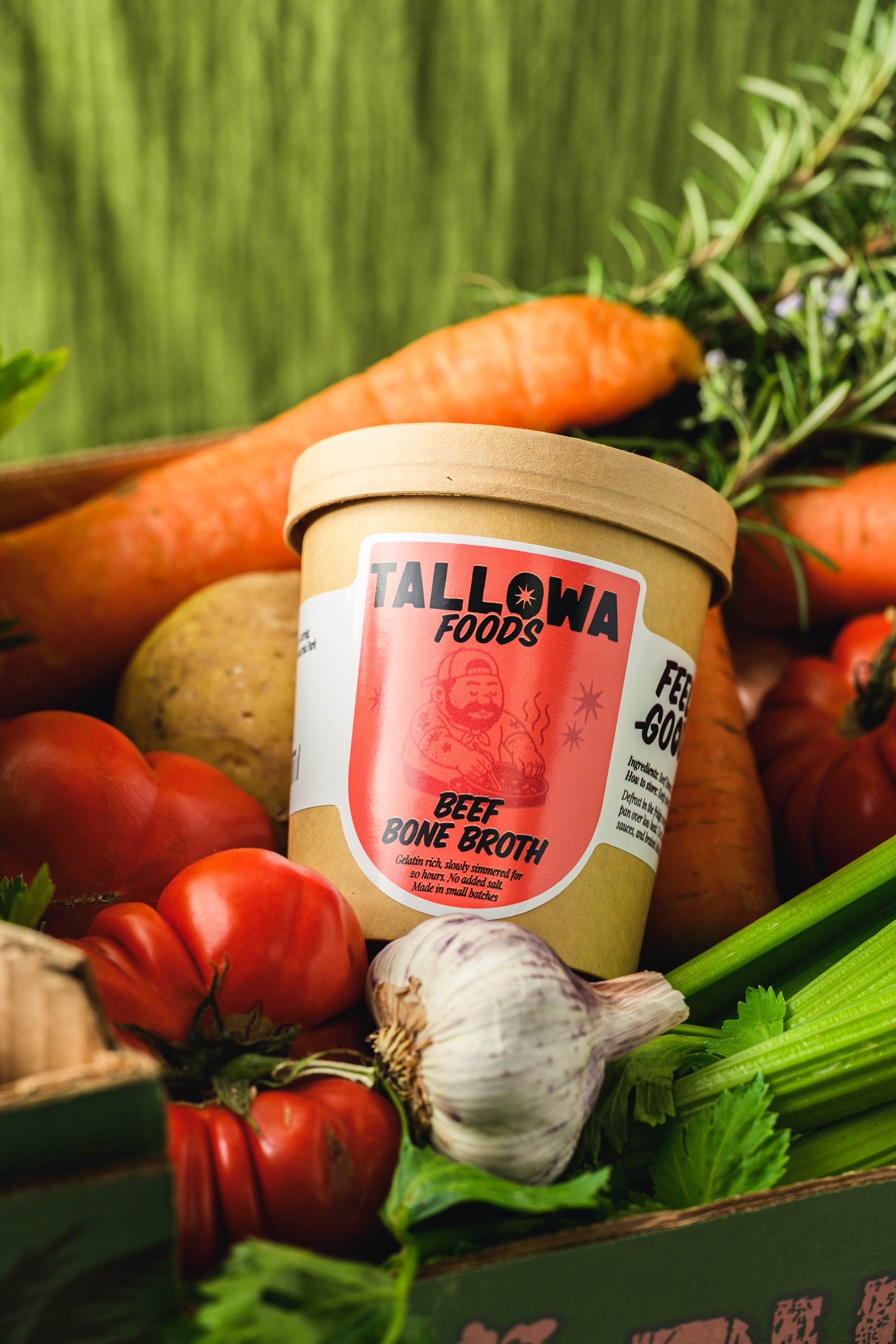 Tallowa beef bone broth jar surrounded by vegetables natural nutrient rich broth in Malta Europe
