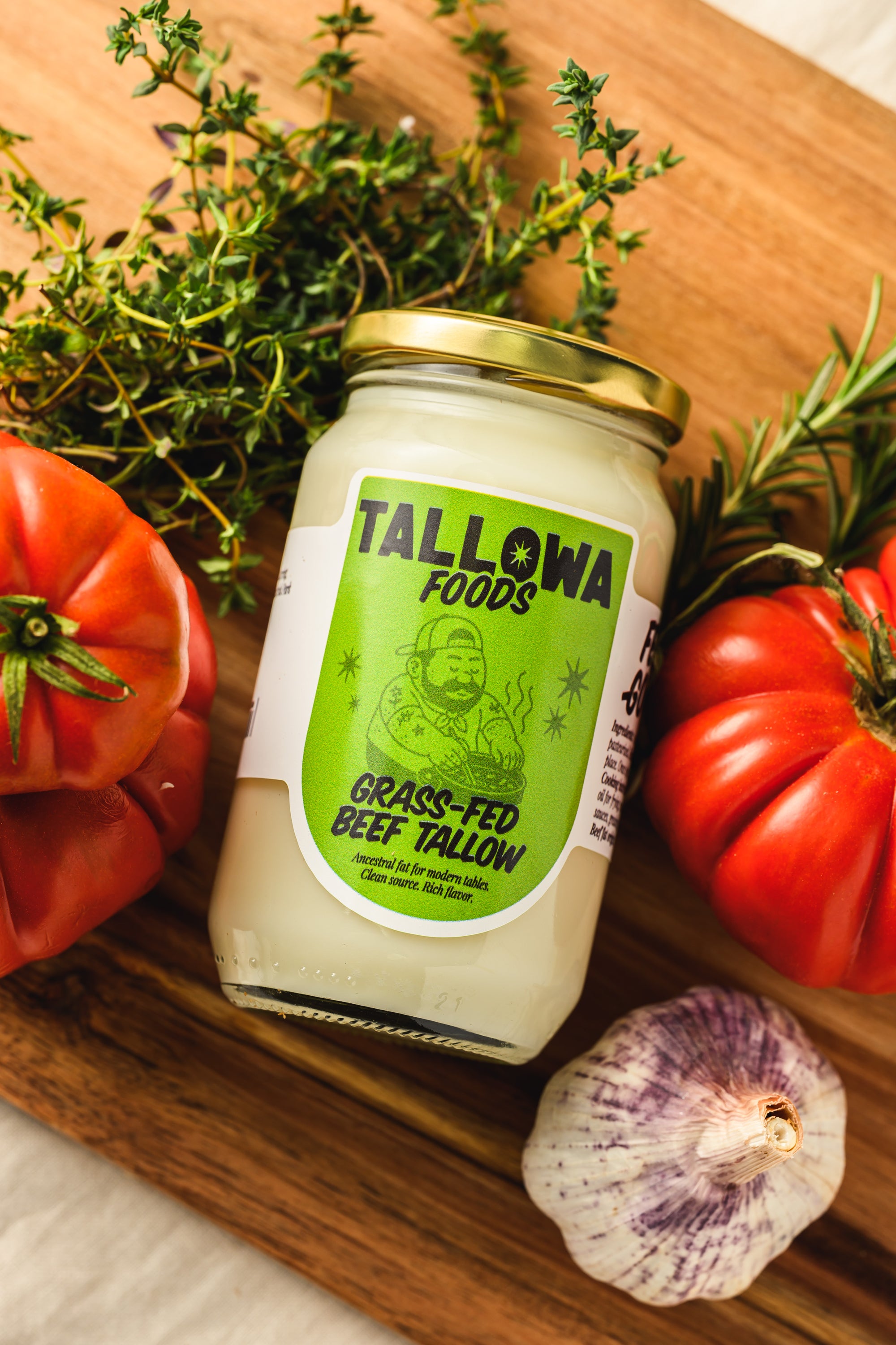 Tallowa grass fed beef tallow jar with garlic herbs and tomatoes ancestral cooking fat in Malta Europe