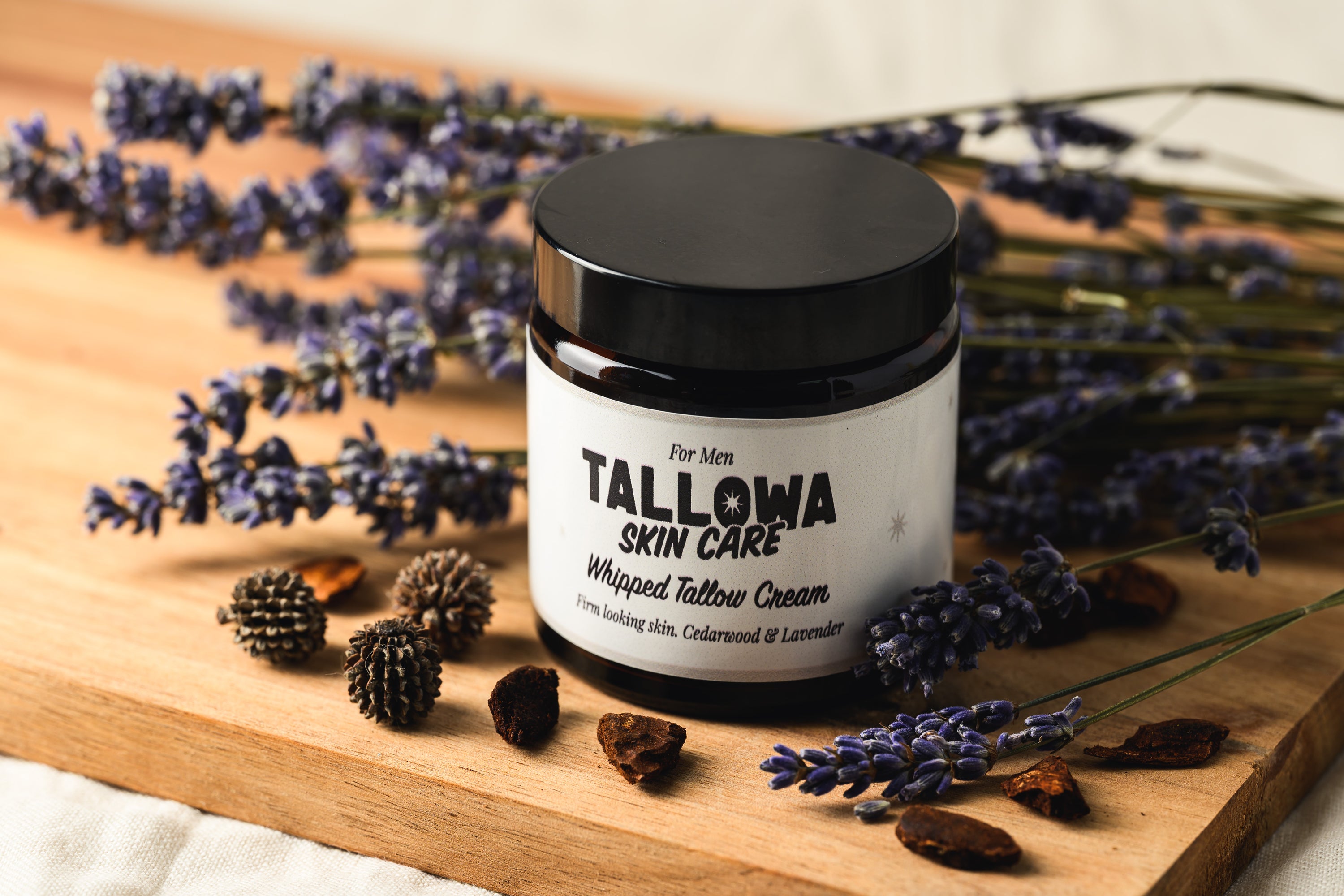 Tallowa men’s grass-fed tallow balm with cedarwood and lavender on wooden board natural skincare flatlay